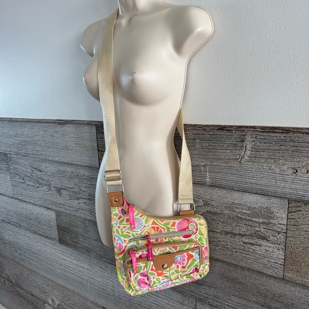 Lily Bloom crossbody bag purse with a floral pattern